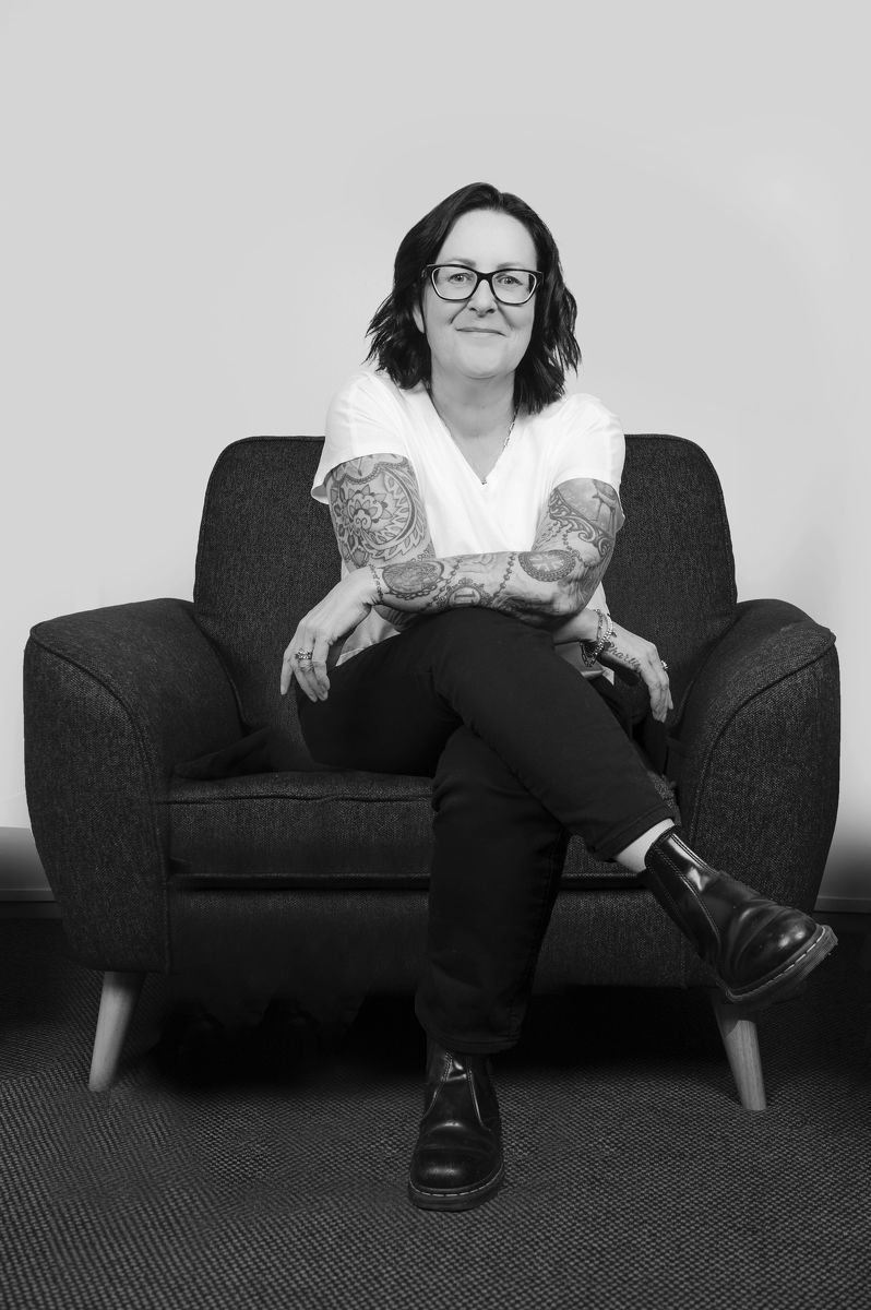 Jo Wadmore sitting on a grey chair