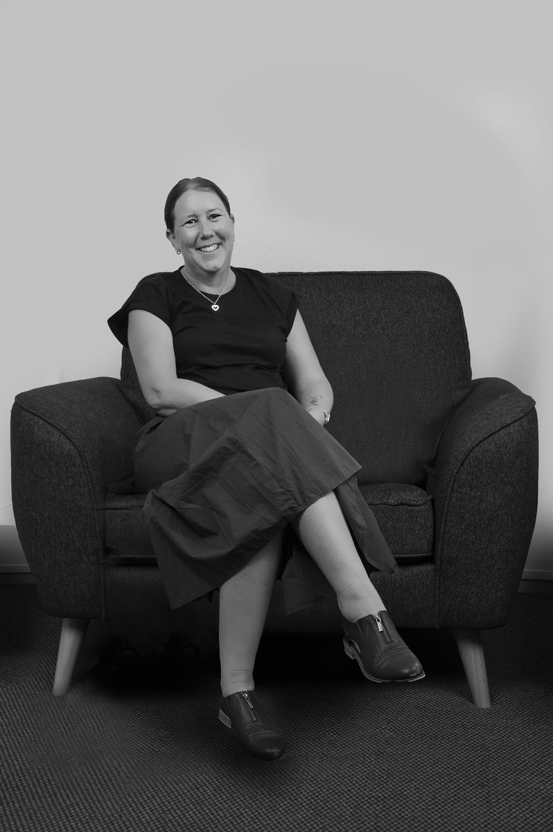 Kirsten Pennell leaning comfortably against the wall