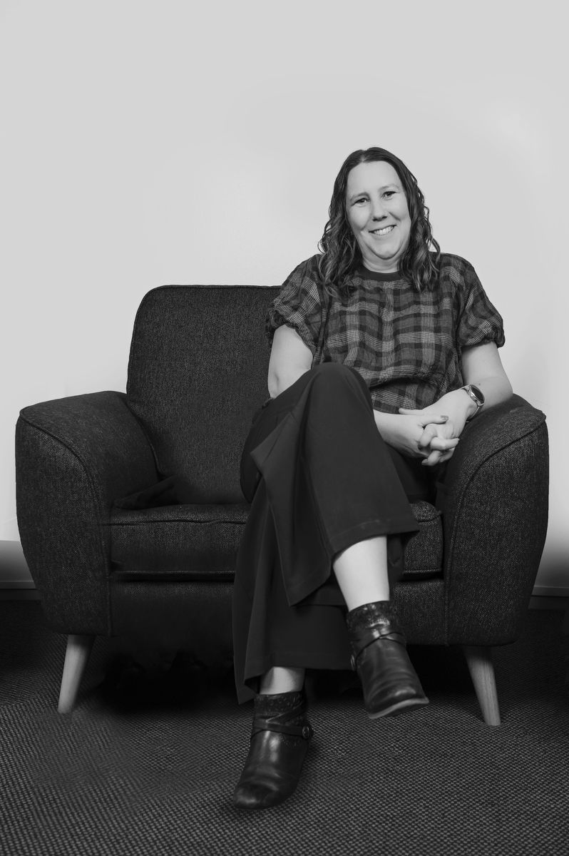 Kirsten Pennell leaning comfortably against the wall